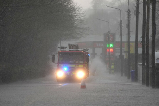 a-fire-engine-drives-through-a-flooded-road-in-bunclody-co-wexford-ireland-hundreds-of-schools-are-closed-and-tens-of-thousands-of-people-are-without-power-as-storm-chandra-batters-the-island-of