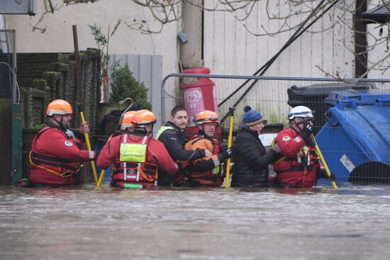 people-are-escorted-through-floodwaters-in-enniscorthy-co-wexford-hundreds-of-schools-are-closed-and-tens-of-thousands-of-people-are-without-power-as-storm-chandra-batters-the-island-of-ireland-p