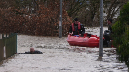 members-of-slaney-search-and-rescue-working-in-floodwater-in-enniscorthy-co-wexford-hundreds-of-schools-are-closed-and-tens-of-thousands-of-people-are-without-power-as-storm-chandra-batters-the-is