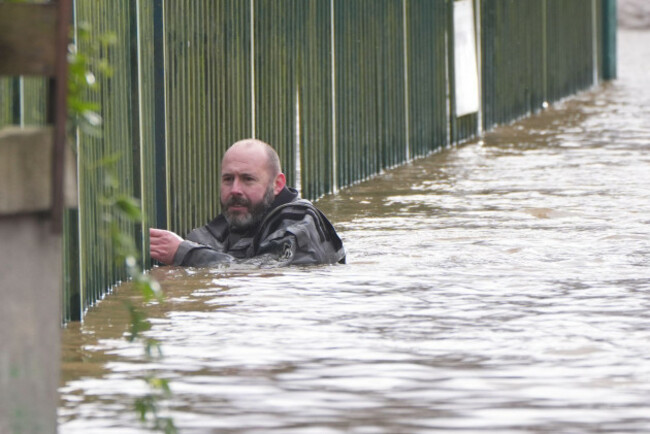 a-members-of-slaney-search-and-rescue-working-in-floodwater-in-enniscorthy-co-wexford-hundreds-of-schools-are-closed-and-tens-of-thousands-of-people-are-without-power-as-storm-chandra-batters-the