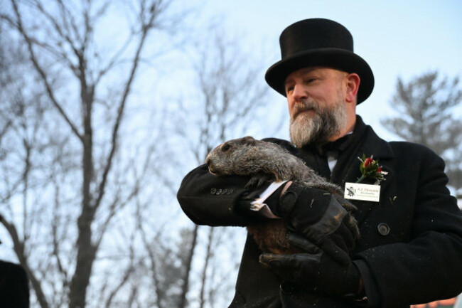 groundhog-club-handler-a-j-dereume-holds-punxsutawney-phil-the-weather-prognosticating-groundhog-during-the-140th-celebration-of-groundhog-day-on-gobblers-knob-in-punxsutawney-pa-monday-feb-2