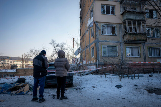 people-look-at-a-damaged-apartment-house-following-russias-missile-and-drone-attack-in-kyiv-ukraine-tuesday-feb-3-2026-ap-photodan-bashakov