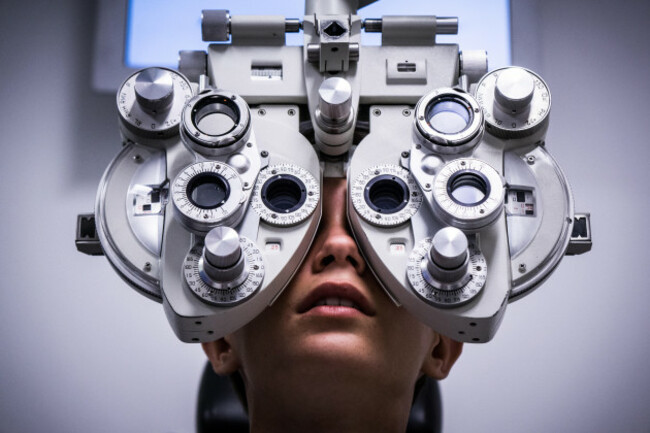 a-boy-having-an-eyetest-using-a-vision-test-machine