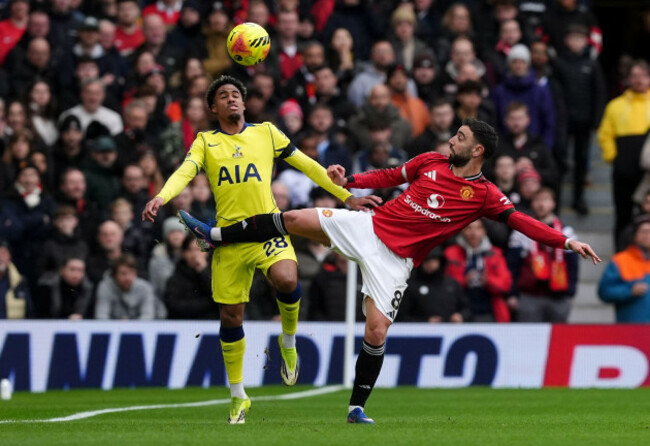 tottenham-hotspurs-wilson-odobert-left-and-manchester-uniteds-bruno-fernandes-battle-for-the-ball-during-the-premier-league-match-at-old-trafford-manchester-picture-date-saturday-february-7-20