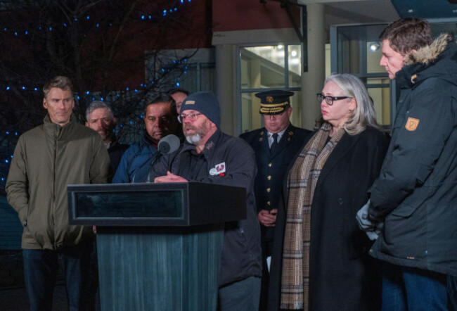 tumbler-ridge-mayor-darryl-krakowka-speaks-alongside-b-c-premier-david-eby-federal-minister-of-housing-and-infrastructure-gregor-robertson-federal-minister-of-public-safety-gary-anandasangaree-and