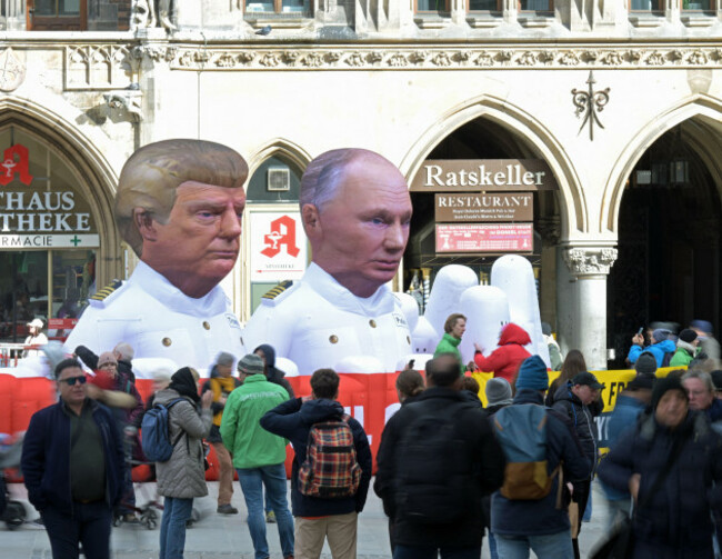 munich-germany-13th-feb-2026-greenpeace-is-protesting-on-marienplatz-in-munich-on-friday-with-larger-than-life-sculptures-of-us-president-trump-and-russian-president-putin-the-two-heads-of-govern