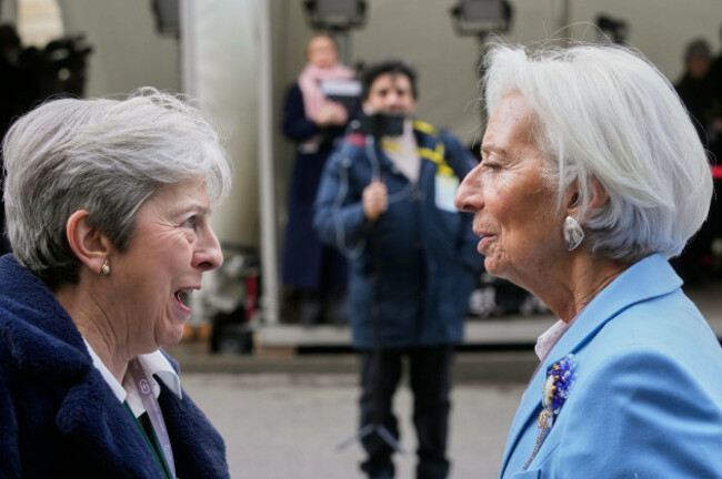european-central-bank-president-christine-lagarde-right-speaks-with-former-british-prime-minister-theresa-may-as-they-arrive-for-the-munich-security-conference-in-munich-germany-friday-feb-13-2