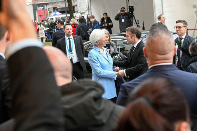 french-president-emmanuel-macron-shakes-hands-with-european-central-bank-ecb-president-christine-lagarde-center-left-at-the-munich-security-conference-in-munich-germany-friday-feb-13-2026-t