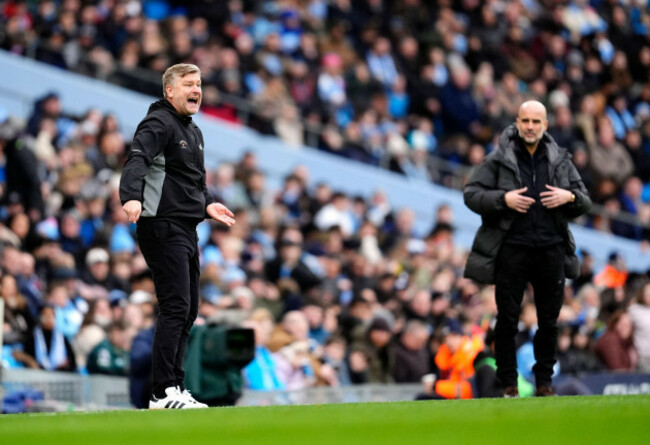salford-city-manager-karl-robinson-left-on-the-touchline-as-manchester-city-manager-pep-guardiola-looks-on-during-the-emirates-fa-cup-fourth-round-match-at-the-etihad-stadium-manchester-picture-da