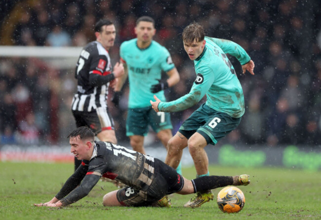 grimsby-towns-darragh-burns-is-fouled-by-wolverhampton-wanderers-david-moller-wolfe-during-the-emirates-fa-cup-fourth-round-match-at-blundell-park-grimsby-picture-date-sunday-february-15-2026