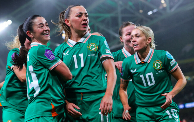 katie-mccabe-celebrates-scoring-a-hat-trick-with-teammates