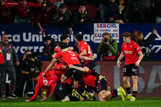 osasunas-raul-garcia-celebrates-with-his-teammates-after-scoring-his-sides-second-goal-during-a-spanish-la-liga-soccer-match-between-osasuna-and-real-madrid-in-pamplona-spain-saturday-feb-21-20