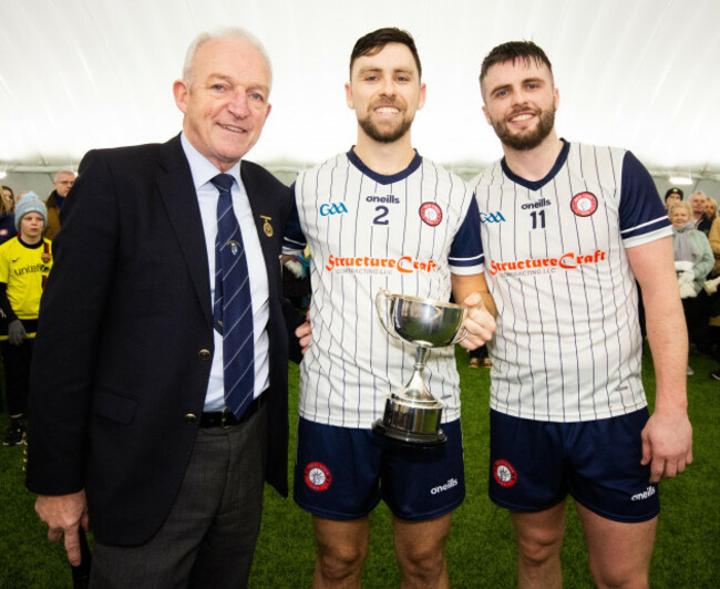 darragh-hynes-and-david-mangan-receive-the-cup-from-john-murphy