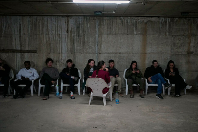 people-sits-in-a-shelter-after-warning-sirens-sound-following-israeli-strikes-on-iran-in-tel-aviv-israel-saturday-feb-28-2026-ap-photoohad-zwigenberg