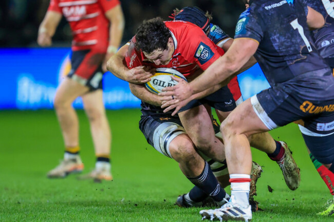 tom-stewart-is-tackled-by-james-fender