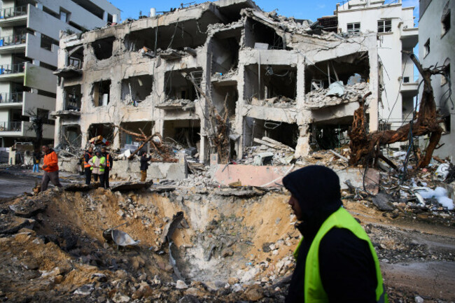 rescue-workers-and-military-personnel-survey-the-scene-of-a-direct-hit-a-day-after-an-iranian-missile-struck-in-tel-aviv-israel-sunday-march-1-2026-ap-photooded-balilty