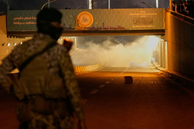 security-forces-fire-tear-gas-to-disperse-a-protest-against-u-s-and-israeli-attacks-on-iran-at-a-bridge-leading-to-the-fortified-green-zone-where-the-u-s-embassy-is-located-in-baghdad-iraq-sunday
