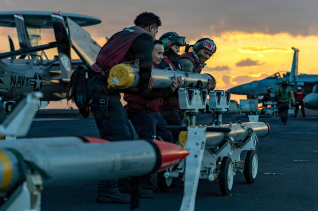 uss-gerald-r-ford-international-waters-28-february-2026-u-s-navy-sailors-move-ordnance-on-the-flight-deck-of-the-ford-class-aircraft-carrier-uss-gerald-r-ford-operating-in-support-of-operation-e
