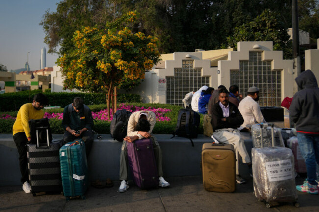 passengers-stranded-by-the-closure-of-dubai-international-airport-await-for-assistance-in-the-airport-parking-lot-in-dubai-united-arab-emirates-sunday-march-1-2026-ap-photoaltaf-qadri