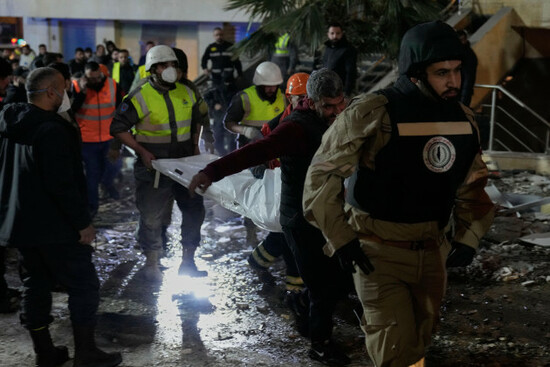 rescue-workers-carry-a-dead-body-in-a-plastic-bag-from-a-building-hit-by-an-israeli-strike-in-jnah-neighborhood-south-of-beirut-lebanon-monday-march-2-2026-ap-photohussein-malla