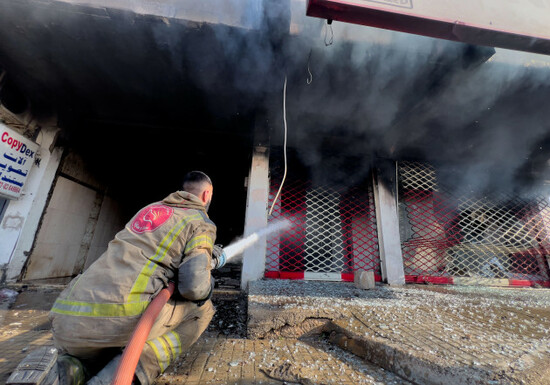 a-firefighter-extinguishes-a-burned-shop-at-a-building-that-was-hit-by-an-israeli-airstrike-in-dahiyeh-a-southern-suburb-of-beirut-lebanon-tuesday-march-3-2026-ap-photohussein-malla