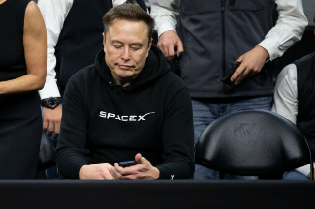 philadelphia-pennsylvania-usa-23rd-mar-2025-elon-musk-checks-his-phone-during-session-six-of-the-2025-ncaa-division-i-wrestling-championships-at-wells-fargo-center-in-philadelphia-pennsylvania