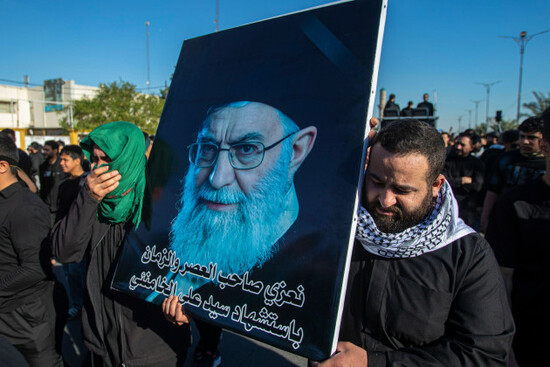 shiite-muslims-hold-pictures-of-iranian-supreme-leader-ayatollah-ali-khamenei-who-was-killed-by-an-u-s-airstrike-in-tehran-during-a-symbolic-funeral-of-sadr-city-baghdad-sunday-march-1-2026-a