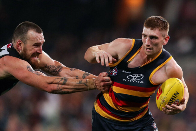 adelaide-australia-29th-july-2023-mark-keane-of-the-crows-evades-charlie-dixon-of-the-power-during-the-afl-round-20-match-between-the-adelaide-crows-and-the-port-adelaide-power-at-the-adelaide-ova