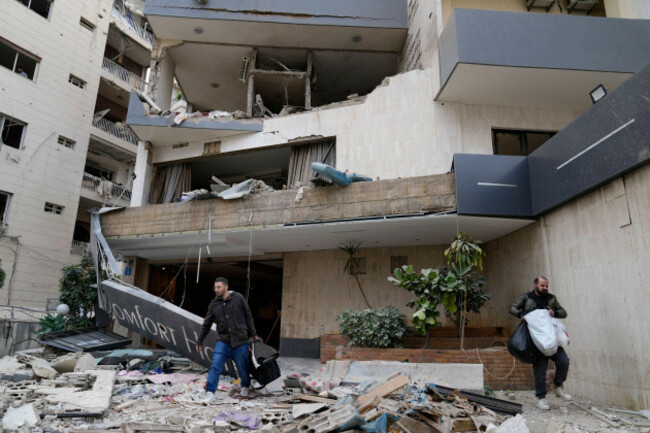 hotel-guests-carry-their-belongings-as-they-leave-a-damaged-hotel-that-was-hit-by-an-israeli-airstrike-in-hazmieh-east-of-beirut-lebanon-wednesday-march-4-2026-ap-photohussein-malla