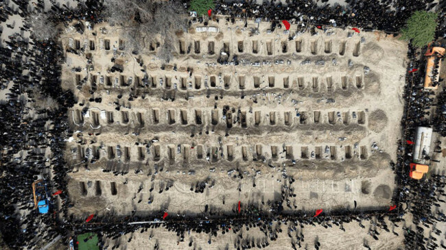 tehran-iran-04th-mar-2026-mourners-dig-graves-during-the-funeral-of-children-killed-in-a-u-s-israeli-airstrike-on-a-primary-school-in-minab-hormozgan-province-iran-on-march-3-2026-more-than