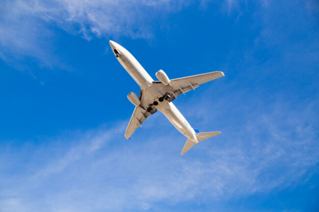 airplane-flying-overhead-with-blue-sky-and-the-bottom-of-the-airplane-as-it-comes-in-for-a-landing-at-san-diego-airport