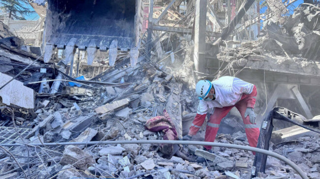 tehran-iran-04th-mar-2026-members-of-iranian-rescue-teams-search-through-the-rubble-for-victims-after-a-building-was-struck-by-u-s-israeli-airstrikes-in-tehran-iran-on-wednesday-march-4-2026