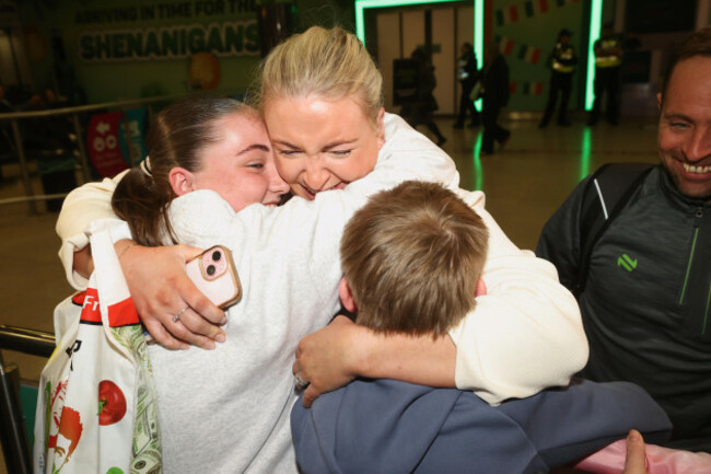 dymphna-mackin-with-her-husband-hugh-mackin-embraces-her-children-as-she-arrives-at-dublin-airport-on-a-flight-from-dubai-in-the-united-arab-emirates-many-people-have-been-in-the-uae-city-since-last