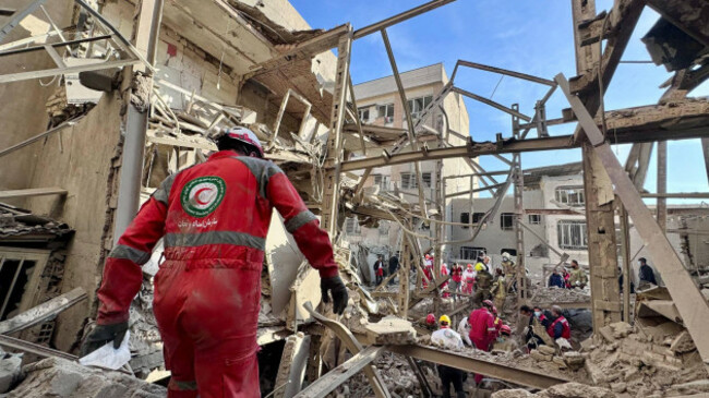 unknown-iran-7th-mar-2026-members-of-the-iranian-red-crescent-society-ircs-rescue-teams-work-at-the-site-of-a-building-damaged-in-an-airstrike-in-iran-the-united-states-and-israel-launched-stri