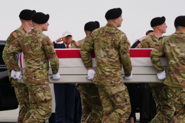 president-donald-trump-salutes-as-an-army-carry-team-moves-the-flag-draped-transfer-case-containing-the-remains-of-u-s-army-reserve-capt-cody-khork-35-of-winter-haven-fla-who-was-killed-in-a-dr