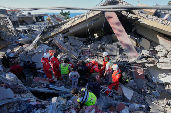 rescue-workers-search-for-victims-at-a-destroyed-building-that-was-hit-by-an-israeli-airstrike-in-ghaziyeh-town-south-lebanon-sunday-march-8-2026-ap-photomohammed-zaatari