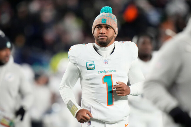 file-miami-dolphins-quarterback-tua-tagovailoa-runs-off-the-field-during-the-first-half-of-an-nfl-football-game-against-the-new-england-patriots-in-foxborough-mass-jan-4-2026-ap-photorobert