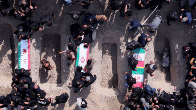 tehran-iran-04th-mar-2026-mourners-dig-graves-during-the-funeral-of-children-killed-in-a-u-s-israeli-airstrike-on-a-primary-school-in-minab-hormozgan-province-iran-on-march-3-2026-more-than