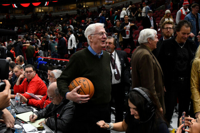 tommy-edwards-center-longtime-public-address-announcer-for-the-chicago-bulls-holds-the-game-ball-after-he-announced-his-retirement-after-an-nba-basketball-game-against-the-houston-rockets-saturday