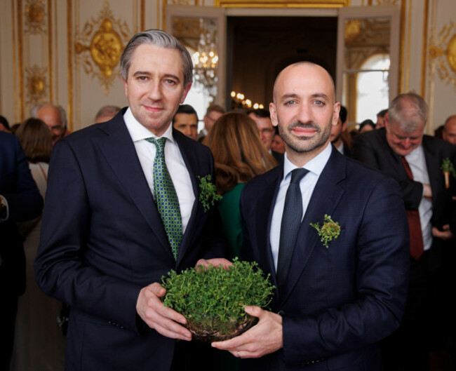 tanaiste-and-finance-minister-simon-harris-right-presents-shamrocks-to-benjamin-haddad-minister-delegate-for-europe-of-france-at-a-st-patricks-day-political-reception-at-the-embassy-of-ireland-i