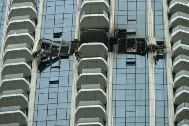 workers-inspect-the-damage-at-the-address-creek-harbour-hotel-after-it-was-hit-by-a-drone-strike-overnight-in-dubai-united-arab-emirates-thursday-march-12-2026-ap-photofatima-shbair