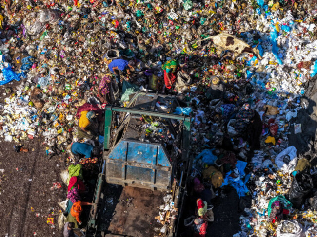 chattogram-bangladesh-25-november-2025-aerial-view-of-anondobazar-landfills-stark-landscape-where-vibrant-colors-of-clothing-contrast-with-the-mu