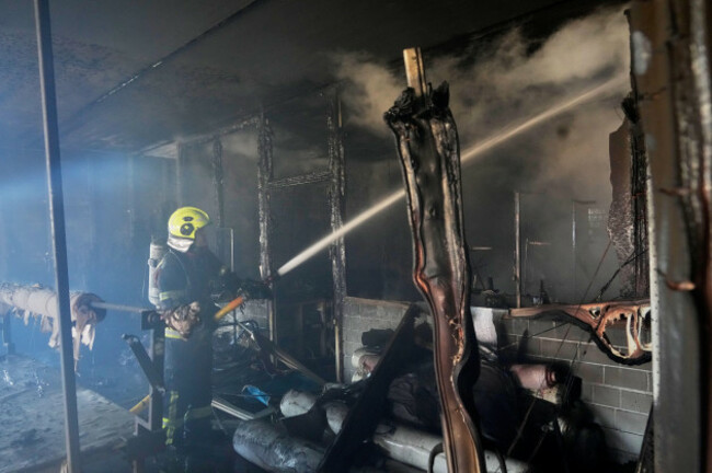 firefighters-put-out-the-fire-at-a-household-services-centre-in-a-residential-neighbourhood-following-a-russia-missile-and-drone-attack-in-brovary-close-to-kyiv-ukraine-saturday-march-14-2026