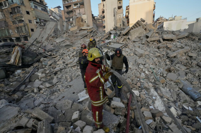 firefighters-and-rescue-workers-work-on-the-rubble-of-a-building-that-was-destroyed-by-an-israeli-strike-in-central-beirut-lebanon-wednesday-march-18-2026-ap-photohussein-malla