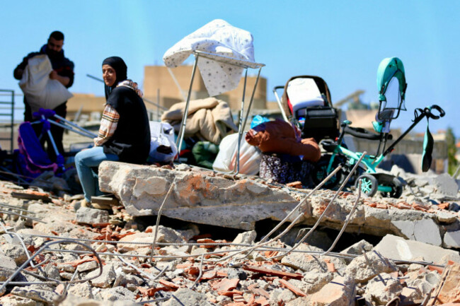 beijing-lebanon-17th-mar-2026-people-search-for-their-belongings-among-the-wreckage-of-a-residential-building-destroyed-in-israeli-airstrikes-near-sidon-southern-lebanon-march-17-2026-credit