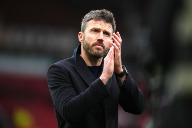 manchester-united-manager-michael-carrick-applauds-the-fans-following-victory-in-the-premier-league-match-at-old-trafford-manchester-picture-date-sunday-march-15-2026