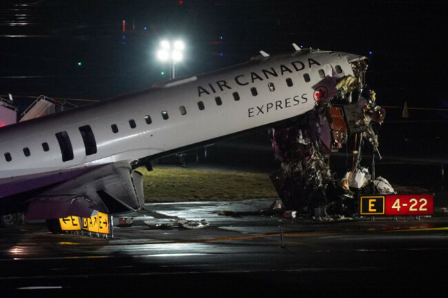 an-air-canada-jet-sits-on-the-runway-at-laguardia-airport-monday-march-23-2026-after-colliding-with-a-port-authority-aircraft-rescue-and-firefighting-vehicle-after-landing-in-new-york-ap-photor