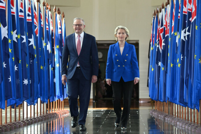 canberra-australia-24th-mar-2026-australian-prime-minister-anthony-albanese-and-president-of-the-european-commission-ursula-von-der-leyen-walk-together-after-an-address-to-members-and-senators-dur