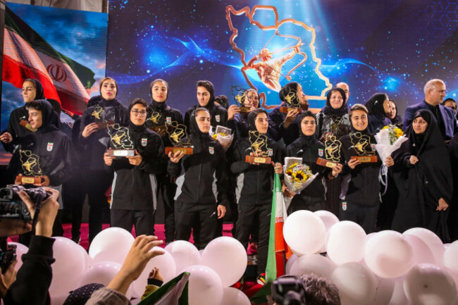 tehran-iran-19th-mar-2026-players-and-members-of-irans-womens-national-football-team-stand-on-stage-during-a-reception-ceremony-at-valiasr-square-in-tehran-following-their-participation-in-the