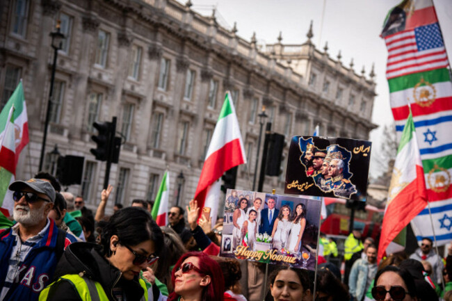 london-uk-22nd-mar-2026-protestors-await-speeches-with-placards-and-flags-during-the-pro-iran-regime-change-rally-at-whitehall-the-majority-of-iranians-see-crown-prince-reza-pahlavi-as-a-credible